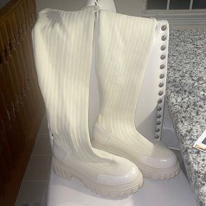 Thigh high sweater boots